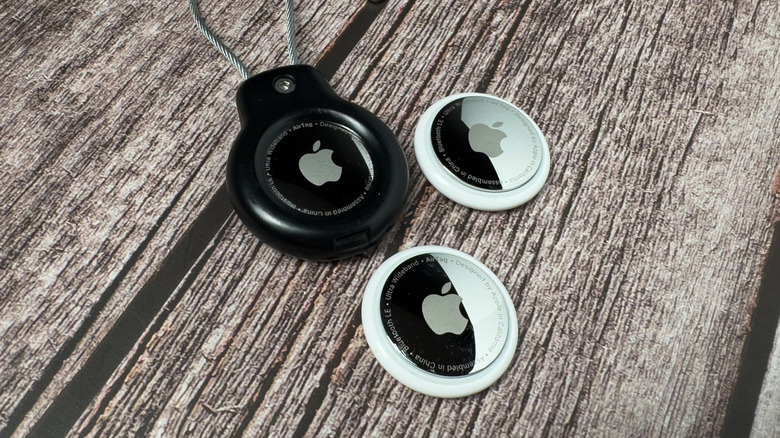 Apple AirTag Two tracking devices sit next to a set of keys