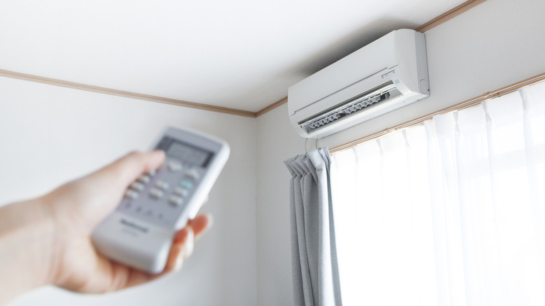 Mini split in home with remote pointed