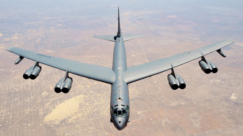 A B-52 Stratofortress flying over the desert