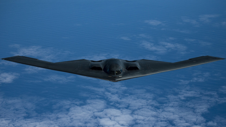B2 bomber flying high over an ocean