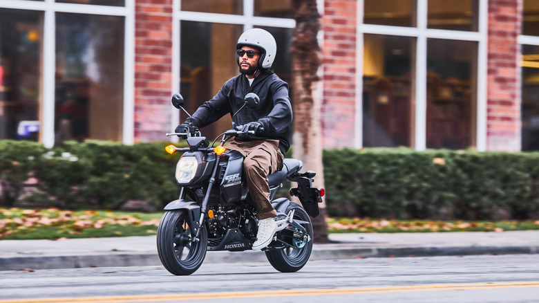 Honda Grom being ridden on city streets