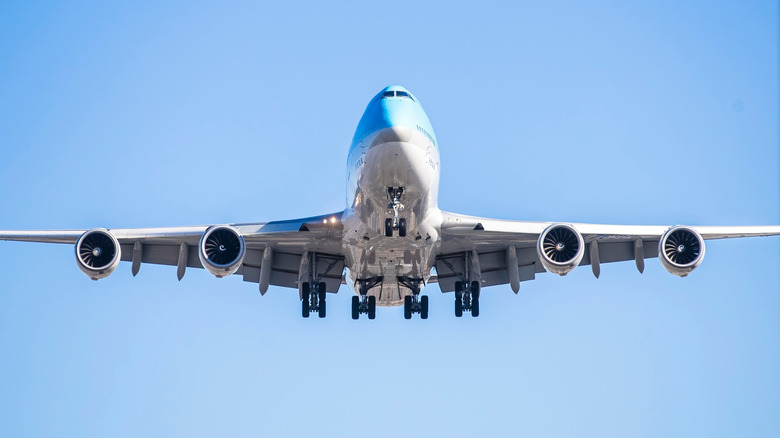 A Boeing 747-8 taking off with landing gear out