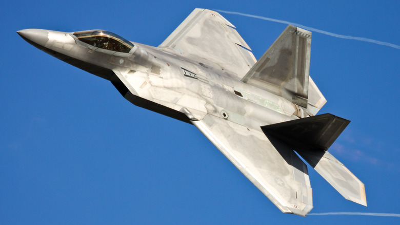 An F-22 Raptor flying over blue skies in 2018