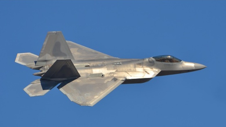 An F-22 Raptor flying over blue skies in 2014