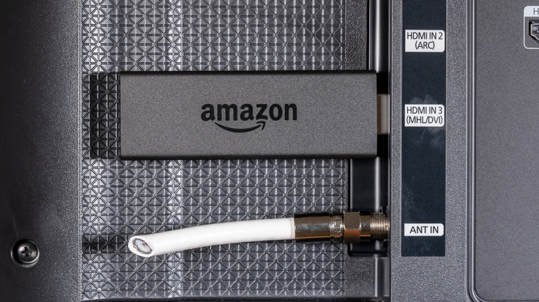 Amazon Fire TV Stick plugged into a TV's HDMI port