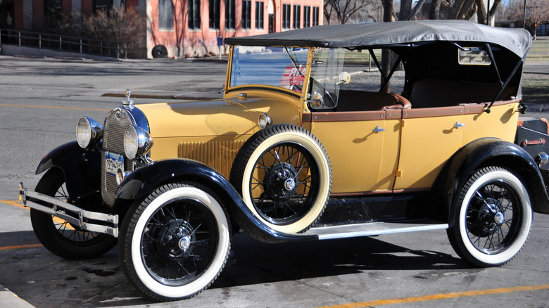 Yellow Ford Model T parked