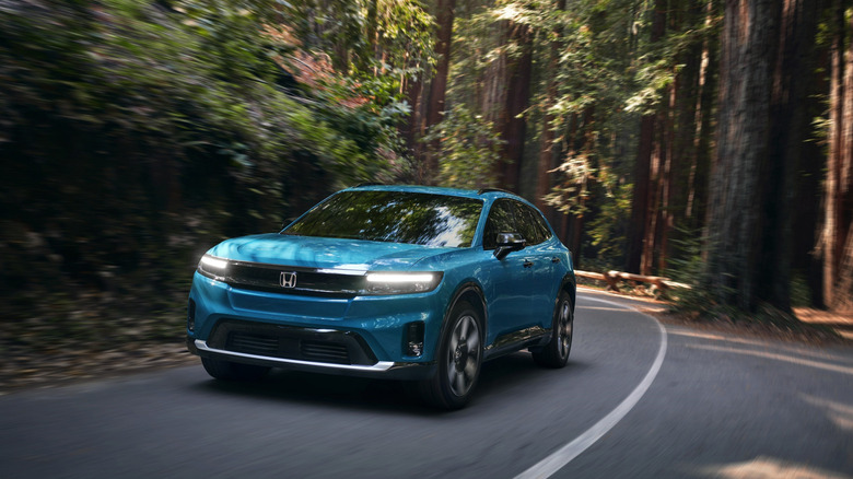 The Honda Prologue photographed travelling inside a wooded area