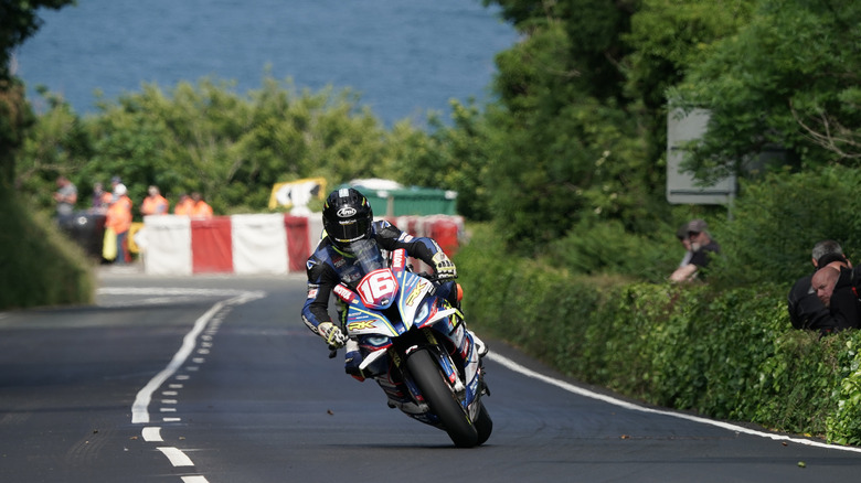 Mike Brown riding a BMW motorcycle in 2023 Isle of Man TT race