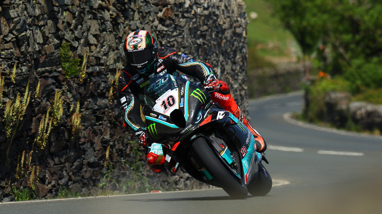 Peter Hickman riding a BMW motorcycle in 2023 Isle of Man TT race
