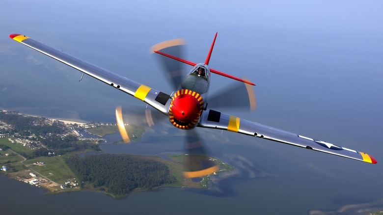 A front view of a restored P-51 Mustang in flight
