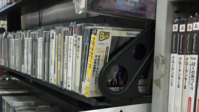 PlayStation and PlayStation 2 games arranged on shelves in Japan
