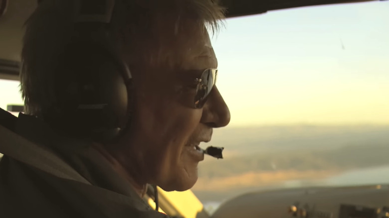 Harrison Ford flying plane with sunglasses and headset