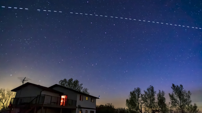 Stream of Starlink satellites crossing the sky