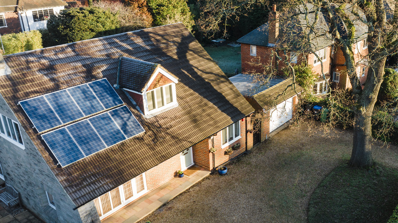 Solar panels, houses in Surrey, sunrise and frost