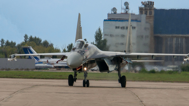 The Sukhoi Su-35 taxis along the runway in preparation for takeoff.