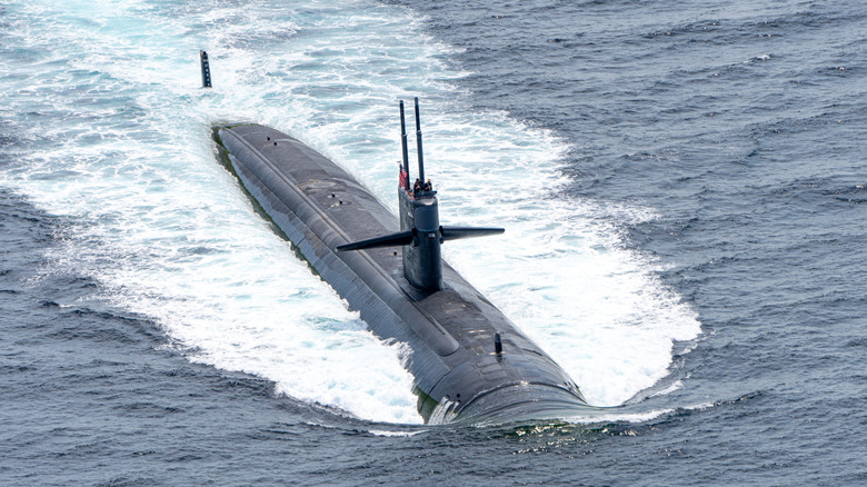 USS Louisville fast attack submarine sails on the surface of the sea
