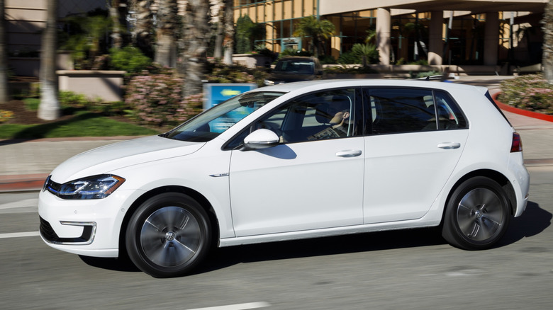 White 2019 Volkswagen E-Golf driving on street