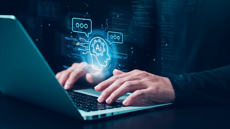man with laptop with stylized AI text