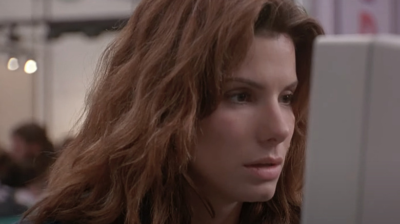 Angela Bennett doing something complicated on her computer in "The Net."