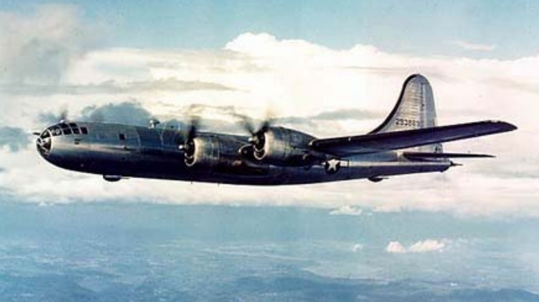 A Boeing B-29 Superfortress flying over cloudy skies