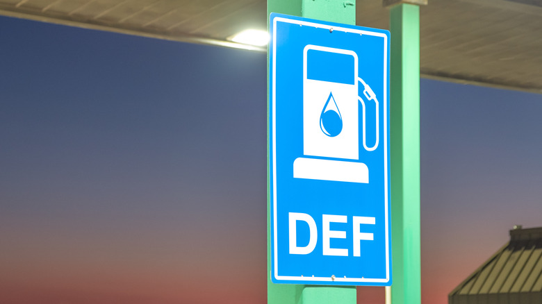 a sign next to a def pump