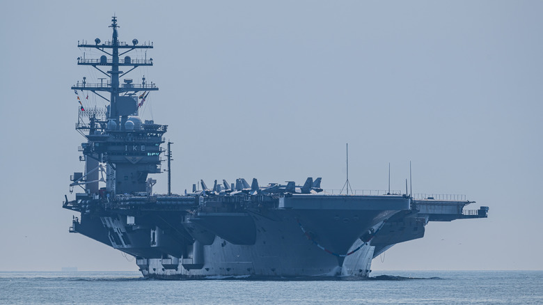 The USS Dwight D. Eisenhower, a Nimitz class aircraft carrier approaching a port