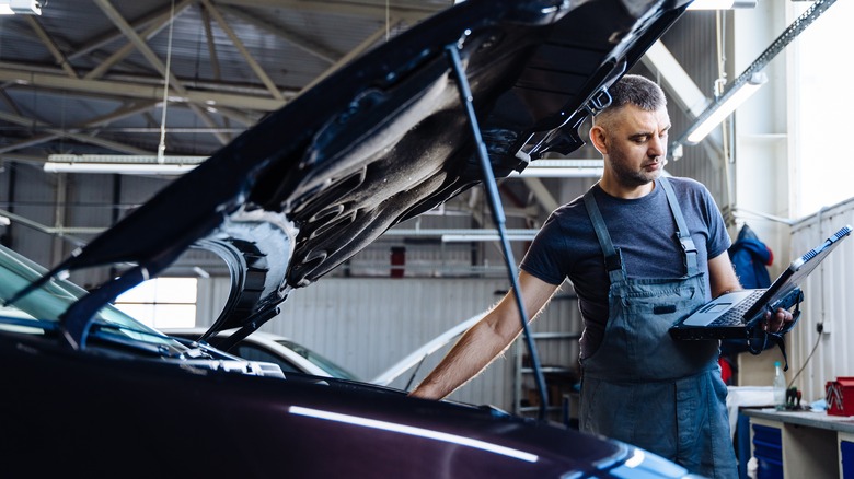 Mechanic working on electric vehicle 