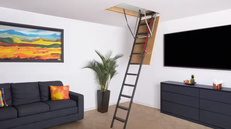Fakro LME metal folding attic ladder in a living room