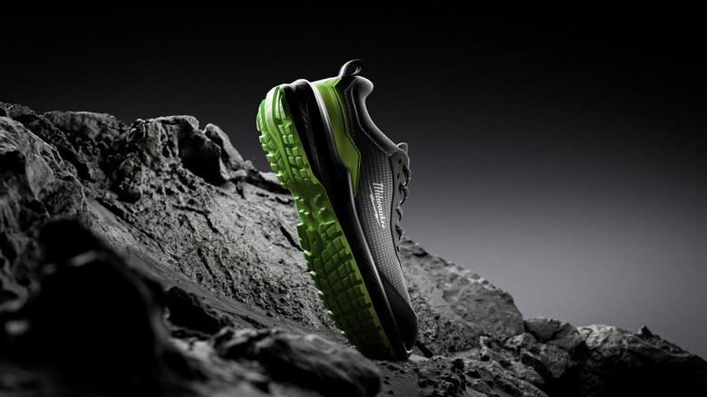 Milwaukee Flextread trainers pictured against a rocky background
