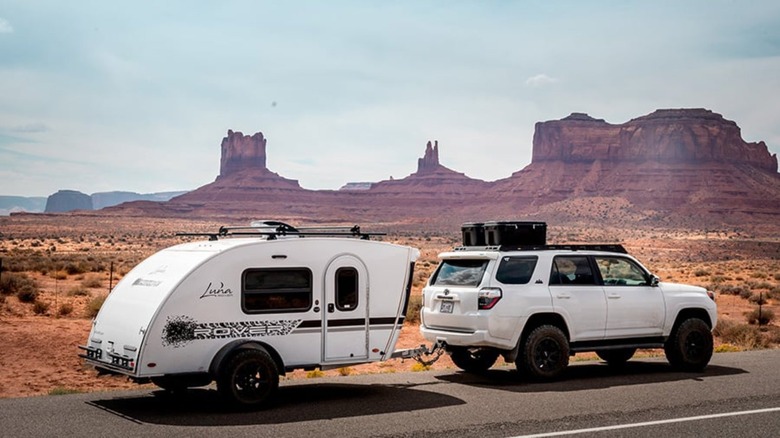 Camper hooked up to a 4Runner in the desert