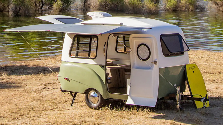 Camper parked next to lake