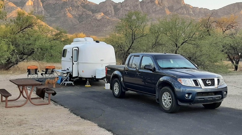 Camper and truck parked on concrete pad