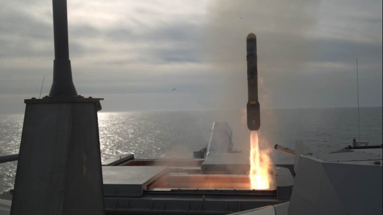 An AGM-114L Longbow Hellfire missile being fired from a ship.