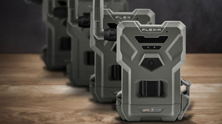 Spypoint Flex Series trail cameras aligned on a table