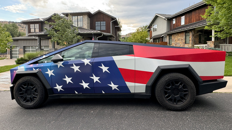 A Cybertruck with an American flag wrap