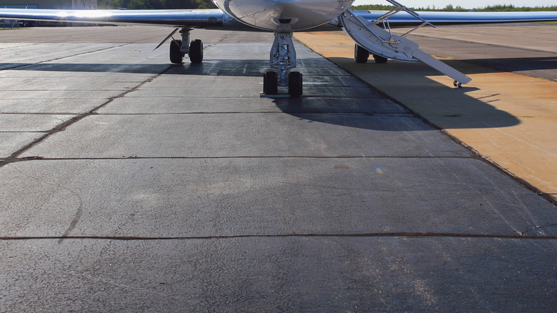 Private jet parked at an airport