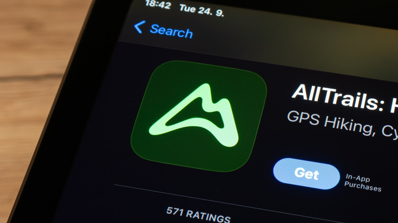 iPhone screen displaying badge for AllTrails app
