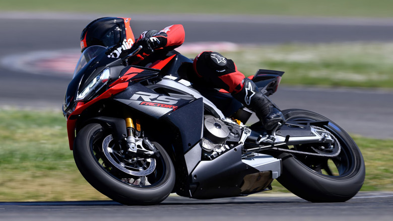 Aprilia RS 660 (Factory Spec) racing through a corner in a closed-track