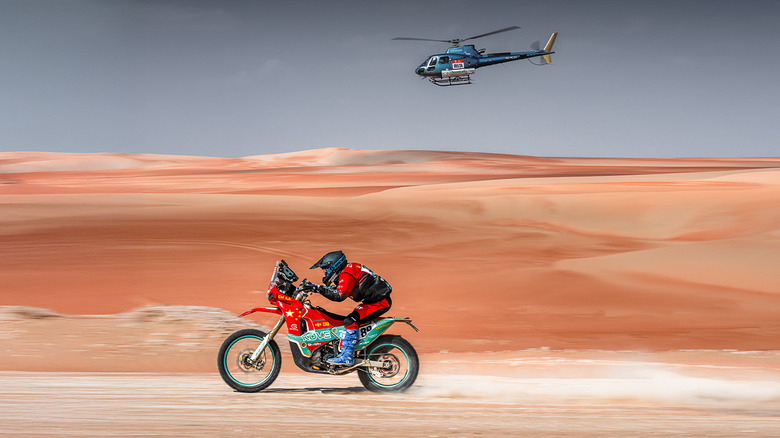 Kove 450 Rally at the Dakar with a support helicopter
