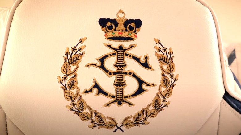 Leather chairs presenting the Sultan's crest via gold stitiching