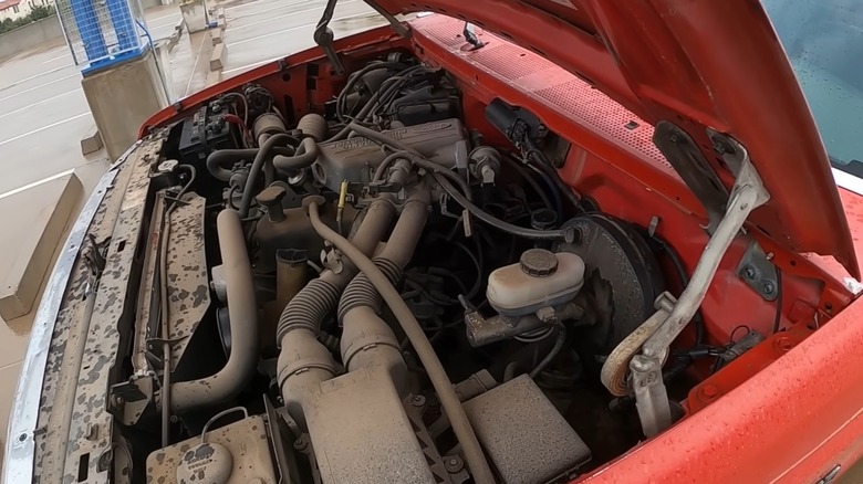Ford fuel-injected 300 straight six inside a red F-150