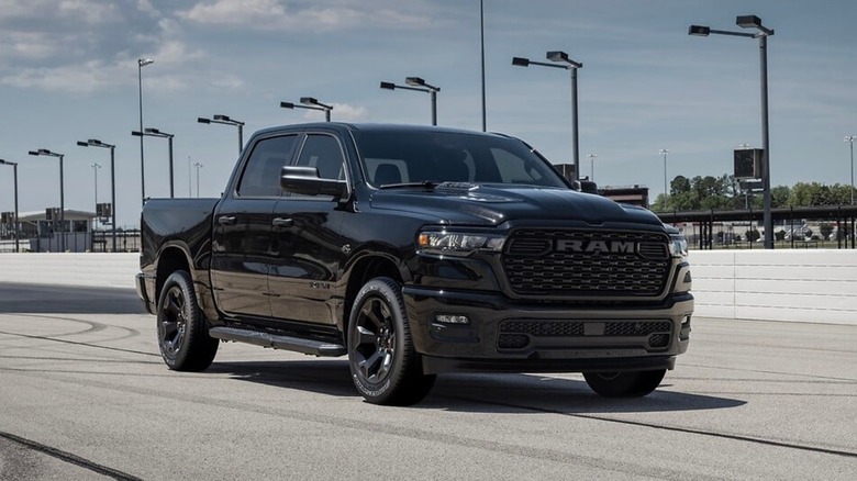 Front quarter view of a black 2026 RAM 1500 Hemi V8 eTorque at a drag strip