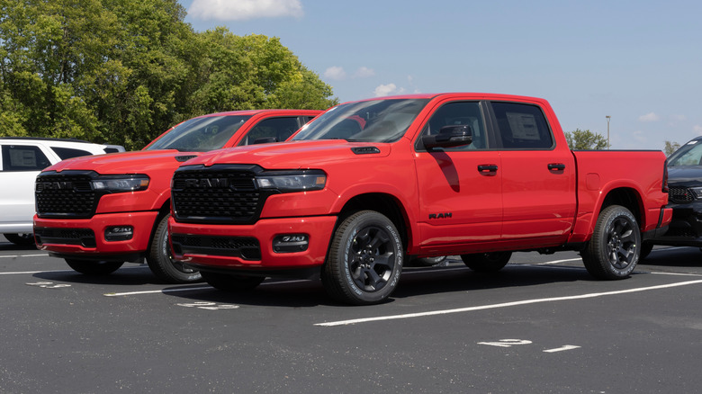Two bright red Hurricane-powered RAM trucks