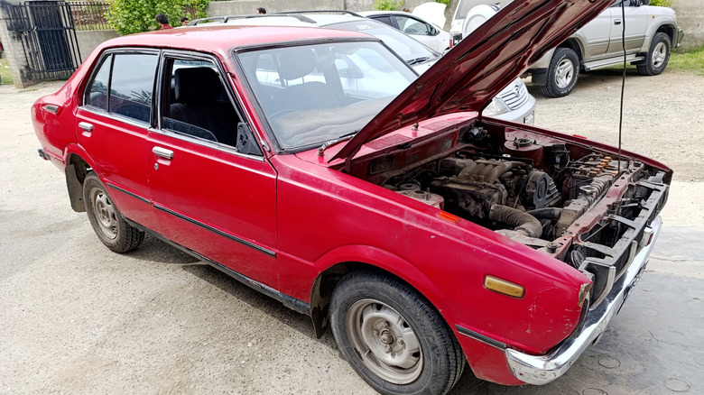 1980 toyota corolla with hood up showing engine