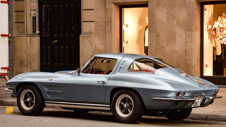 1963 split-window Corvette in blue parked in the street