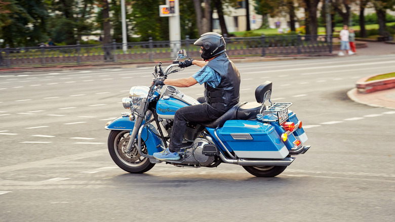 Harley Davidson Road King model in motion on the city road.