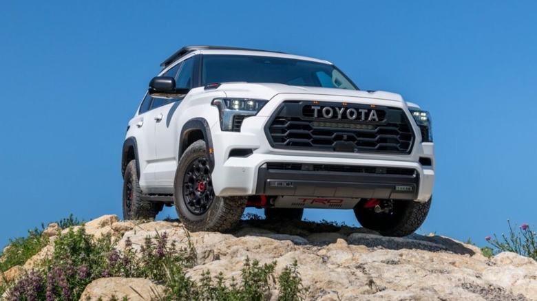 Shot of a white 2025 Toyota Sequoia TRD Pro parked on rocks