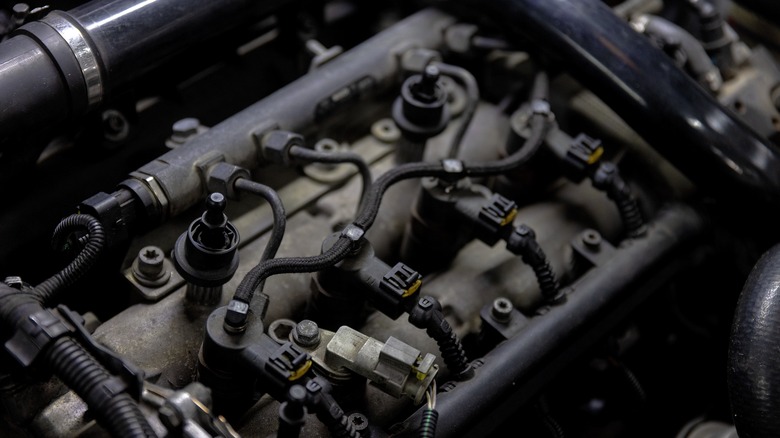 A close-up of an old and dirty car engine