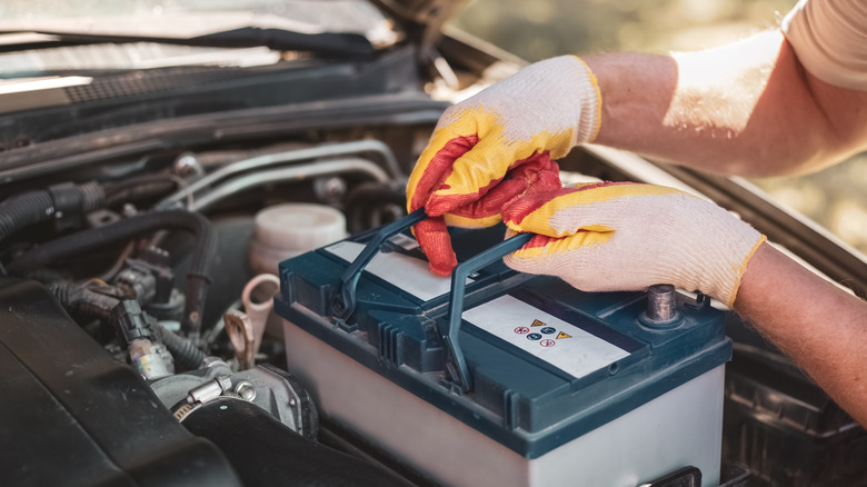 A man shaking hands with a car mechanic