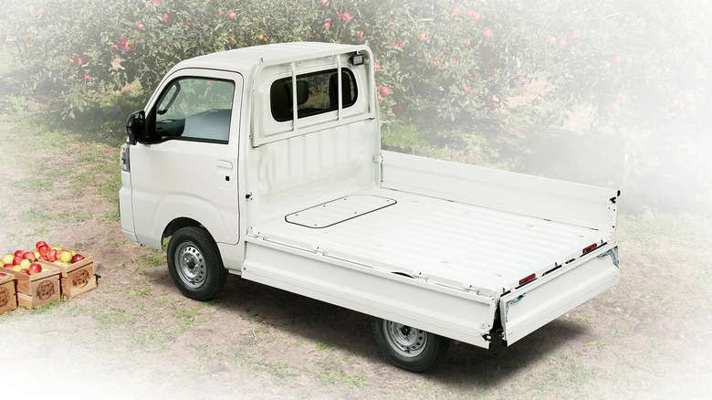 Subaru Sanbar, rear-left three-quarter view, with left-side bed panel and tailgate folded down for loading